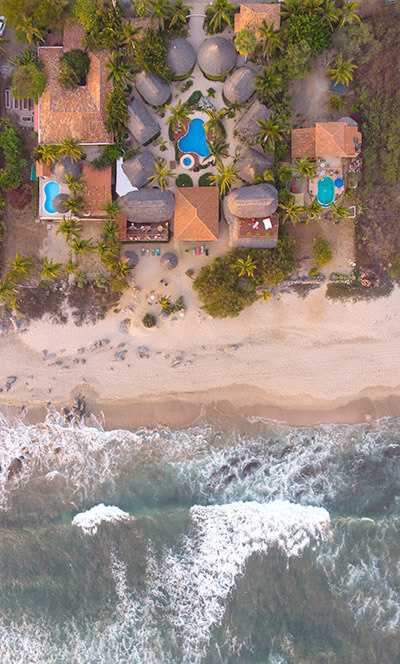 Present Moment Retreat from overhead with ocean waves